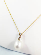 Load image into Gallery viewer, 10 Kt Yellow Gold Oval Fresh Water Pearl and Diamond Pendent.
